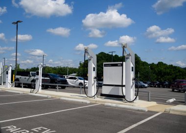 Pavement markings and EV charging station  at a car dealer ship.