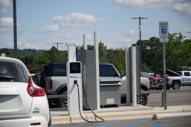 EV charging station in a parking lot at a car dealer ship.