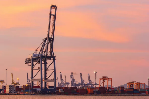 Cargo cranes in industrial port at sunset. — Stock Photo, Image