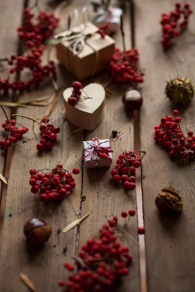 Autumn composition with dry leaves gifts and berries,view from above