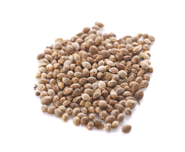 Heap of hemp seeds on white background