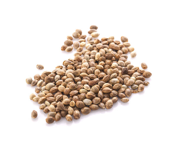 Heap of hemp seeds on white background