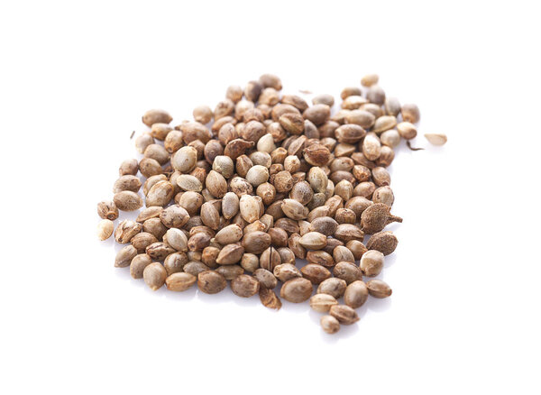 Heap of hemp seeds on white background