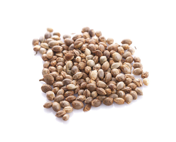 Heap of hemp seeds on white background