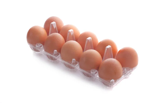 10块棕色鸡蛋。透明鸡蛋包装托盘前视图, — 图库照片