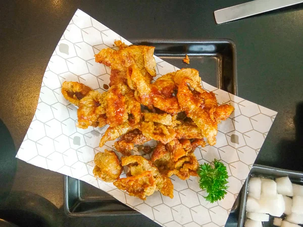 Crispy fried chicken skin in korean restaurant.