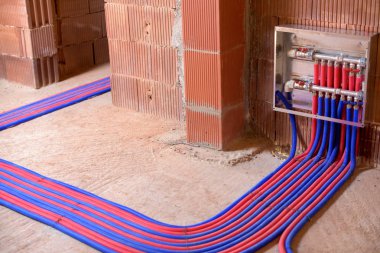 Floor pipes in two colors, red and blue, and control panel clipart