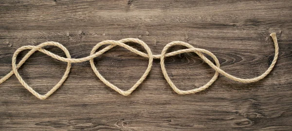 Three Heart Rope Shapes Old Wood — Stock Photo, Image