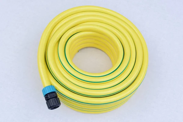 Plastic Yellow Rolled Hose Pipe Connector White Background — Stock Photo, Image