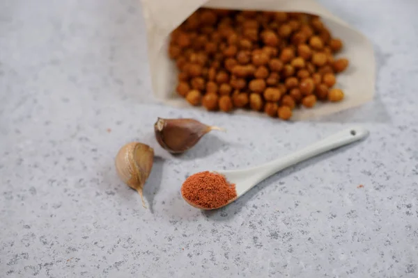 Vegan healthy snack,spicy roasted chickpeas in bowl. Selective focus, space for text.