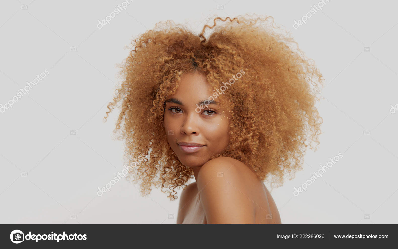Mixed race black blonde model with curly hair Stock Photo by ©kazzakova  222286026