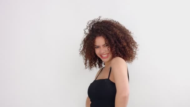 Mixed Race Black Woman With Freckles And Curly Hair In Studio On