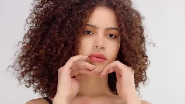 Mixed race black woman with freckles and curly hair closeup portrait with hair blowing — Stock Video