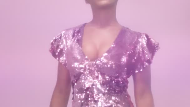 Black mixed race woman with short haircut and curly natural hair wears sequin sparkly dress in pink — Stock Video