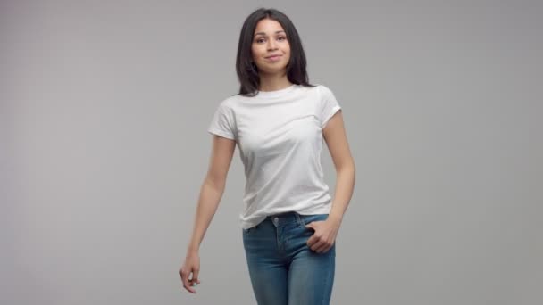 Young mixed race woman in studio in casual look — Stock Video