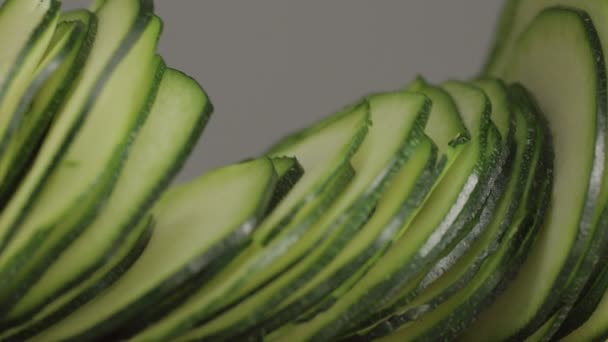 Slices of zucchini falling on table. macro slowmotion — Stock Video