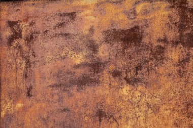 Paslı sarı-kırmızı desenli metal yüzey. Metal levhanın dokusu oksitlenme ve aşınmaya eğilimlidir. Grunge Biçiminde Dokulu Arkaplan