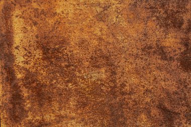 Paslı sarı-kırmızı desenli metal yüzey. Metal levhanın dokusu oksitlenme ve aşınmaya eğilimlidir. Grunge Biçiminde Dokulu Arkaplan