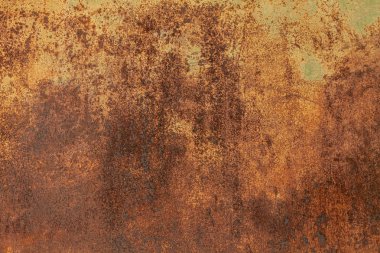 Paslı sarı-kırmızı desenli metal yüzey. Metal levhanın dokusu oksitlenme ve aşınmaya eğilimlidir. Grunge Biçiminde Dokulu Arkaplan