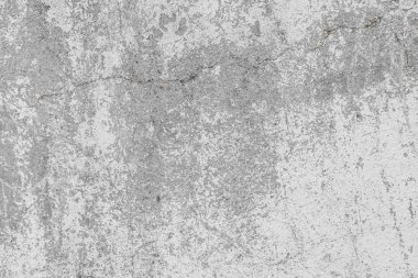 Üzerinde çizikler, çatlaklar, toz, yarıklar, pürüzler ve sıva olan eski gri beton duvarın dokusu. Tasarım için poster ya da arkaplan olarak kullanılabilir