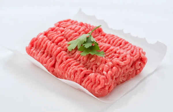 block ground beef with hot pepper on white background