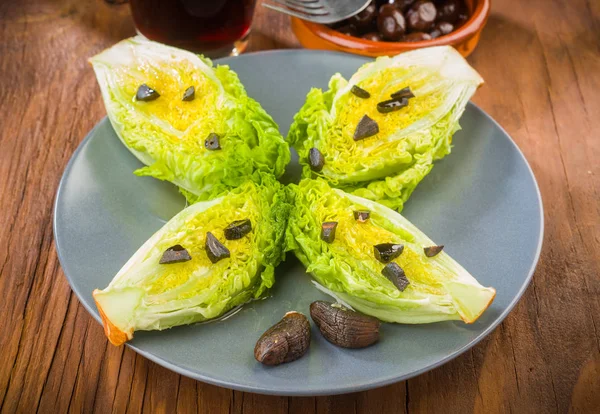 lettuce hearts with olive oil and black garlic