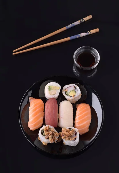 sushi on black base in shiny black porcelain