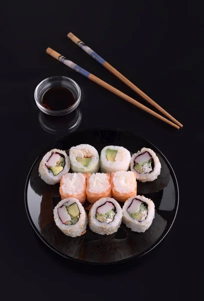 sushi on black base in shiny black porcelain