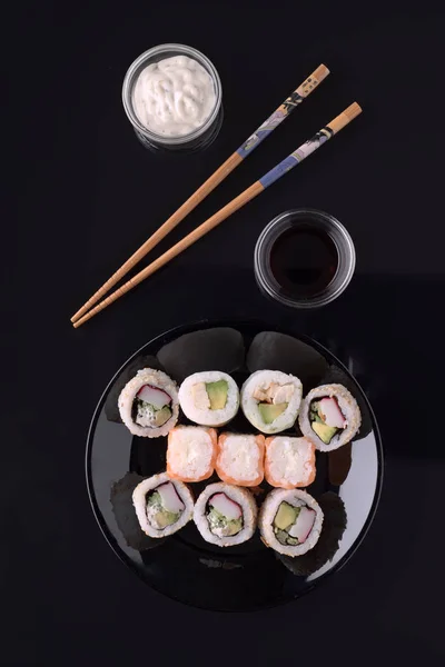 sushi on black base in shiny black porcelain