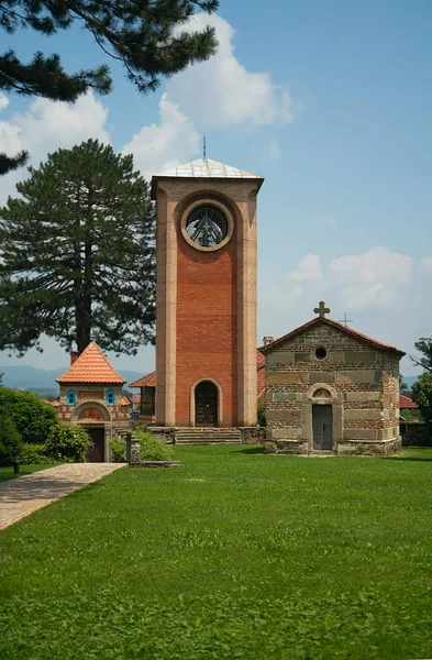 Gate chapel of Saint George (1925-1932), Bell tower (1925-1932) and Church of Saints Theodore Tyron and Theodore Stratelates (now Church of Saints Peter and Paul, 13th century) in Zhicha Monastery, Serbia