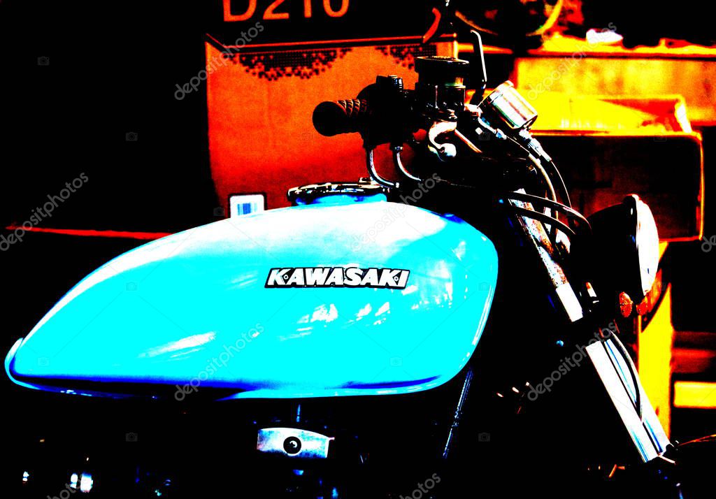 Milan, Italy - May 21, 2017: evocative imagine of turquoise colored tank of a Kawasaki motorcycle with logo
