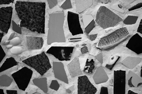 evocative image of black and white mosaic texture with various shapes