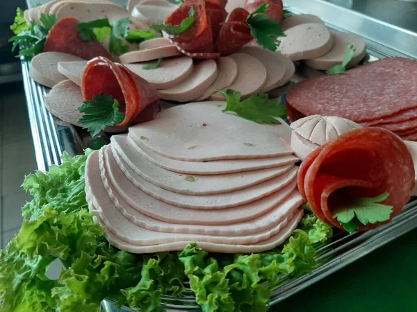sliced salami varieties on serving plate