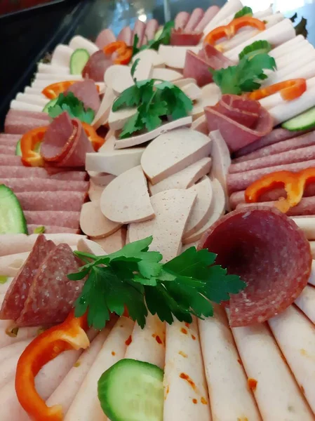 sliced salami varieties on serving plate