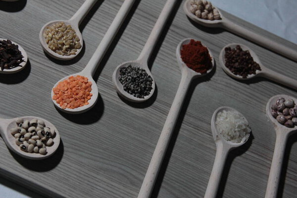 organic spices in wooden spoons