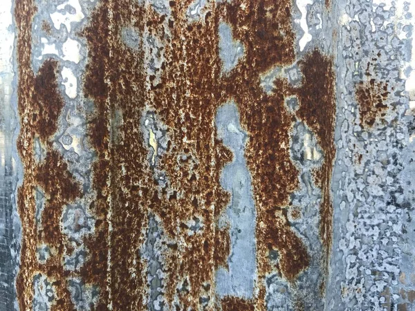 zinc sheet with many of brown rust, used as background or decoration in vintage and retro concept