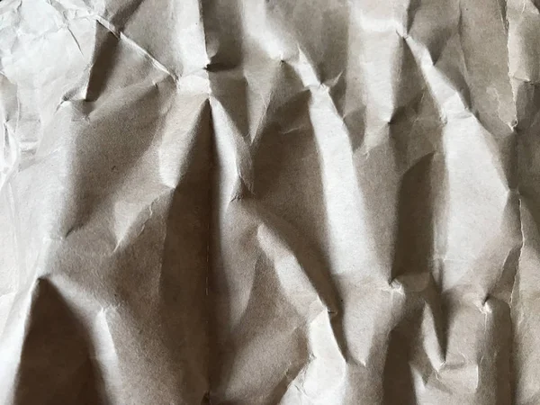 Brown crumpled paper in full frame looks like rock — Stock Photo, Image