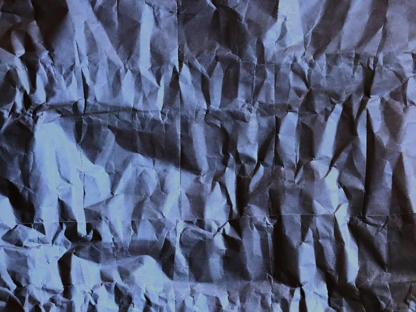 Dramático papel crumpled azul escuro em quadro completo — Fotografia de Stock