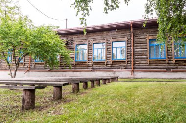 street theatre wood benches, museum - school Vasily Shukshin clipart