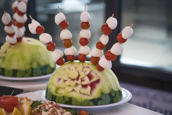 Beautifully carved watermelon. Watermelon carving - food decoration.