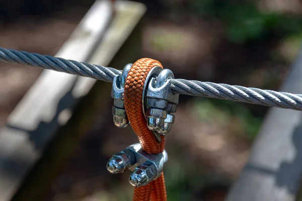 Steel cable fastening mechanism, part of the cable route. Extreme sport.