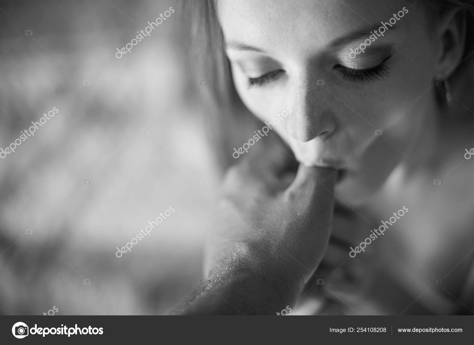 Women erotically licking their fingers