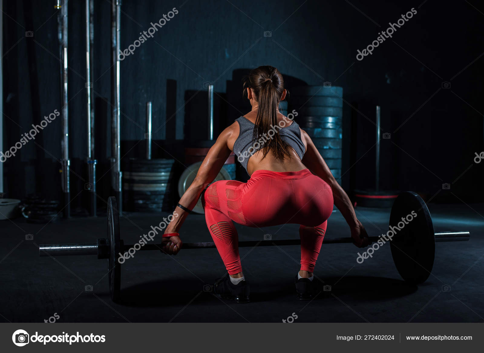 Young, European, muscular girl in red leggings, doing exercise