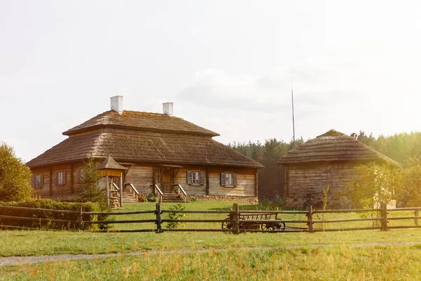 Wooden ethnic houses on rural landscape - village of birthplace of Tadeusz Kosciuszko - Kossovo, Belarus.