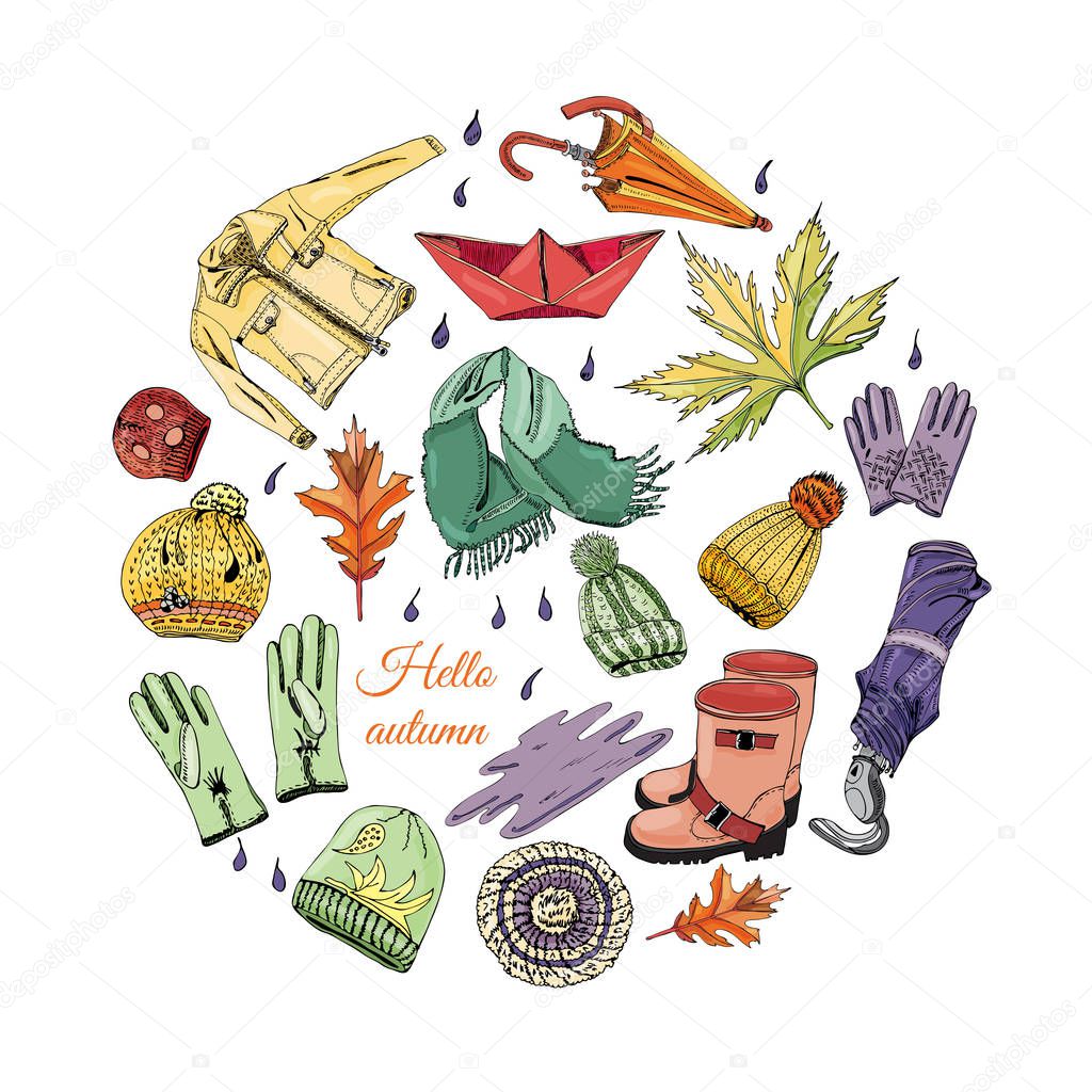 Circle composition with hand drawn of items of autumn clothes and leaves. Ink and colored sketch elements  isolated on white background.