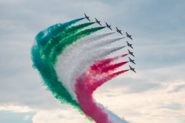 United Kingdom, Fairford - 13.7.2018 Frecce Tricolori display during the Royal International Air Tattoo in 13.07.2018 in Fairford, United Kingdom  clipart