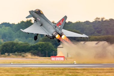 United Kingdom, Fairford - 13.7.2018 Eurofighter Typhoon display during the Royal International Air Tattoo in 13.07.2018 in Fairford, United Kingdom  clipart