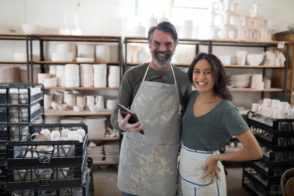 Smiling Potter Colleagues Using Tablet Looking Camera Pottery Workshop — Stock Photo, Image