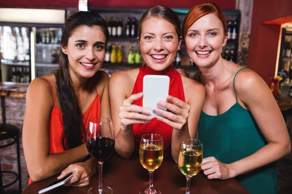 Portrait Female Friends Using Mobile Phone While Enjoy Wine — Stok Foto