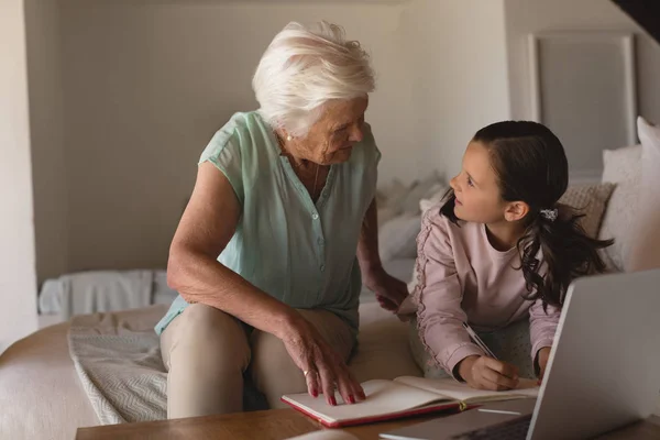 Front View Grandmother Helping Her Granddaughter Homework Living Room Home — Stock Photo, Image